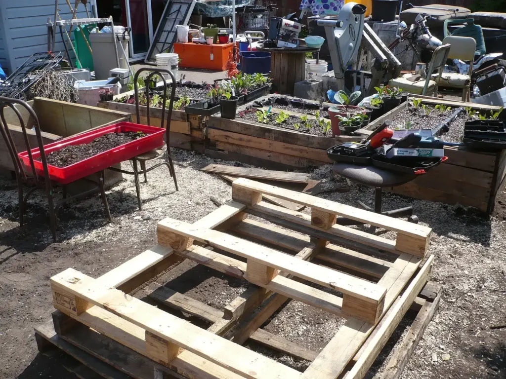 A raised garden bed built from reclaimed pallet wood